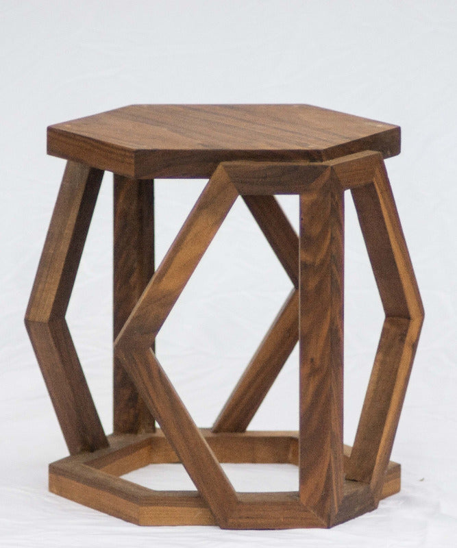 Wooden hexagonal side table on a white background